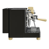 Black espresso machine with wooden handle on a white background, featuring the Leva Brevetti logo.