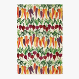A multicolored tea towel with a pattern of vibrant carrots and beets.