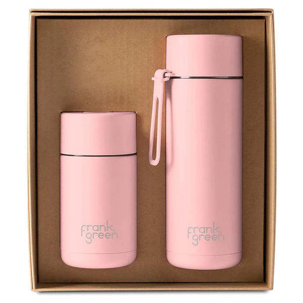 Two pink reusable water bottles in a cardboard box, branded 'frank green'.