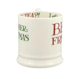 White mug with text in green and red on a white background