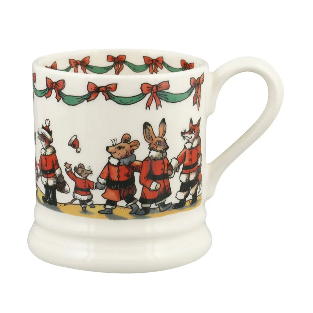 White mug with festive design of mice in red coats and bows on a white background