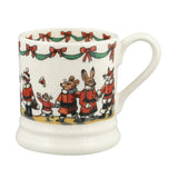 White mug with festive design of mice in red coats and bows on a white background
