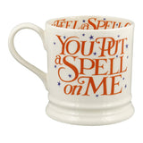 White mug with orange text 'You Put a Spell on Me' on a white background