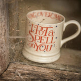 Mug with text 'I Put a Spell on You' in a rustic setting