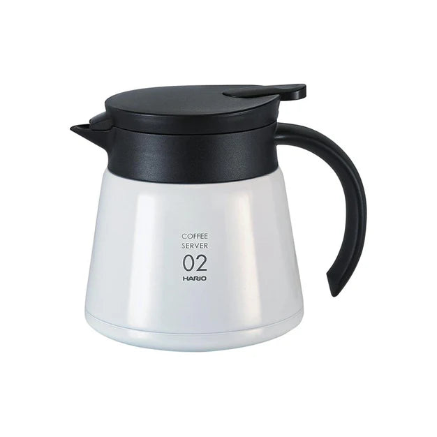 Coffee server with black lid and handle on a white background