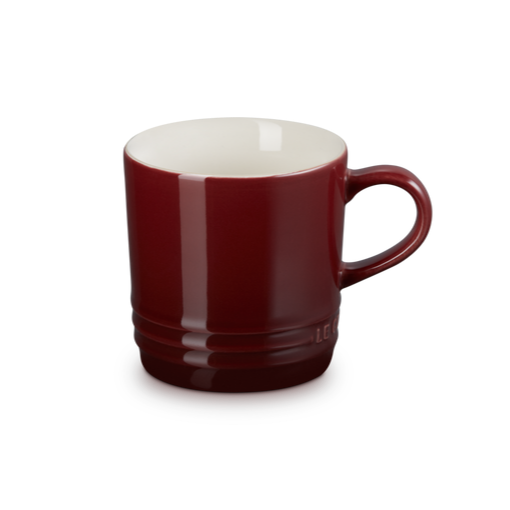 Red mug with a white interior on a white background