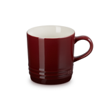 Red mug with a white interior on a white background