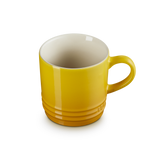 Yellow mug on a white background
