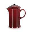 Red ceramic teapot on a white background