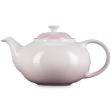 White teapot on a white background