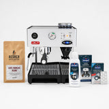 Leit espresso machine with coffee beans, cleaning products, and filters on a white background