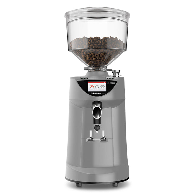 Coffee grinder with clear container filled with coffee beans on a white background