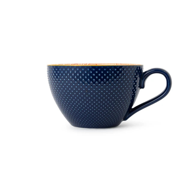 Navy blue textured mug with a handle on a white background