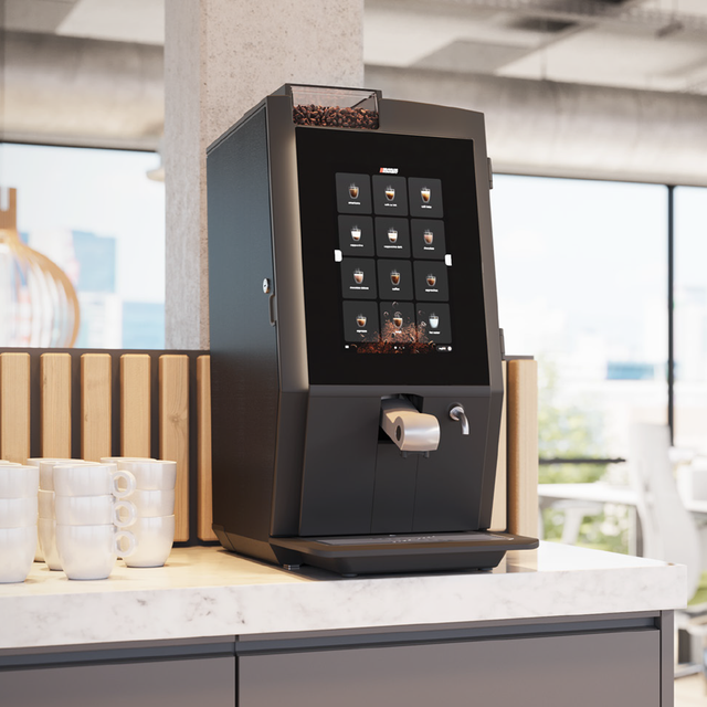 Bravilor Esprecious 21L Bean-to-Cup Coffee Machine – robust design with large 21L water tank, dual canisters for coffee beans and instant ingredients, easy-to-use touchscreen, and automatic rinsing program. Suitable for high-volume environments with up to 210 cups per day.
