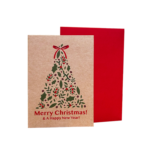 Christmas card with holly tree design and red envelope on beige background