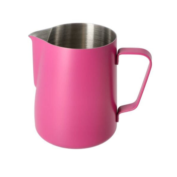 Pink milk pitcher with a stainless steel interior on a white background