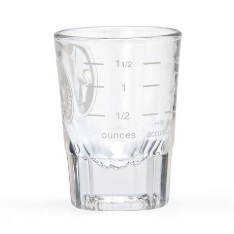 Clear glass measuring cup with etched measurements on a white background