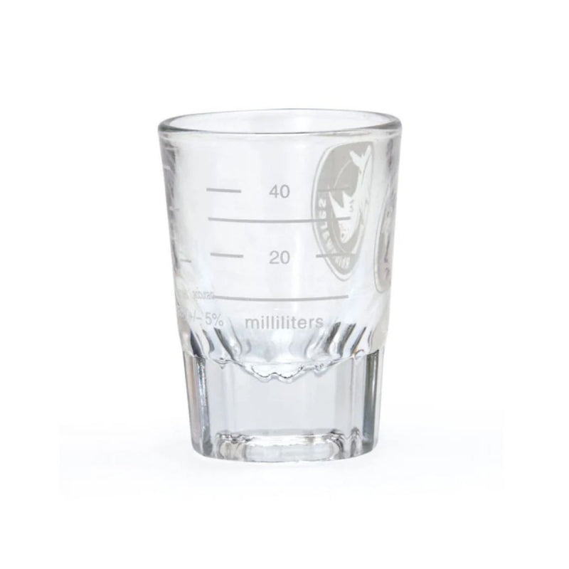 Clear glass measuring cup with milliliter markings on a white background