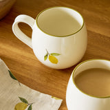 Sophie Allport Top view of the Lemons stoneware mug showing its olive-green rim