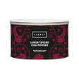 Canister of Simply Luxury Spiced Chai Powder with decorative black and red label