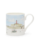 Mug with a lighthouse and boat design on a white background