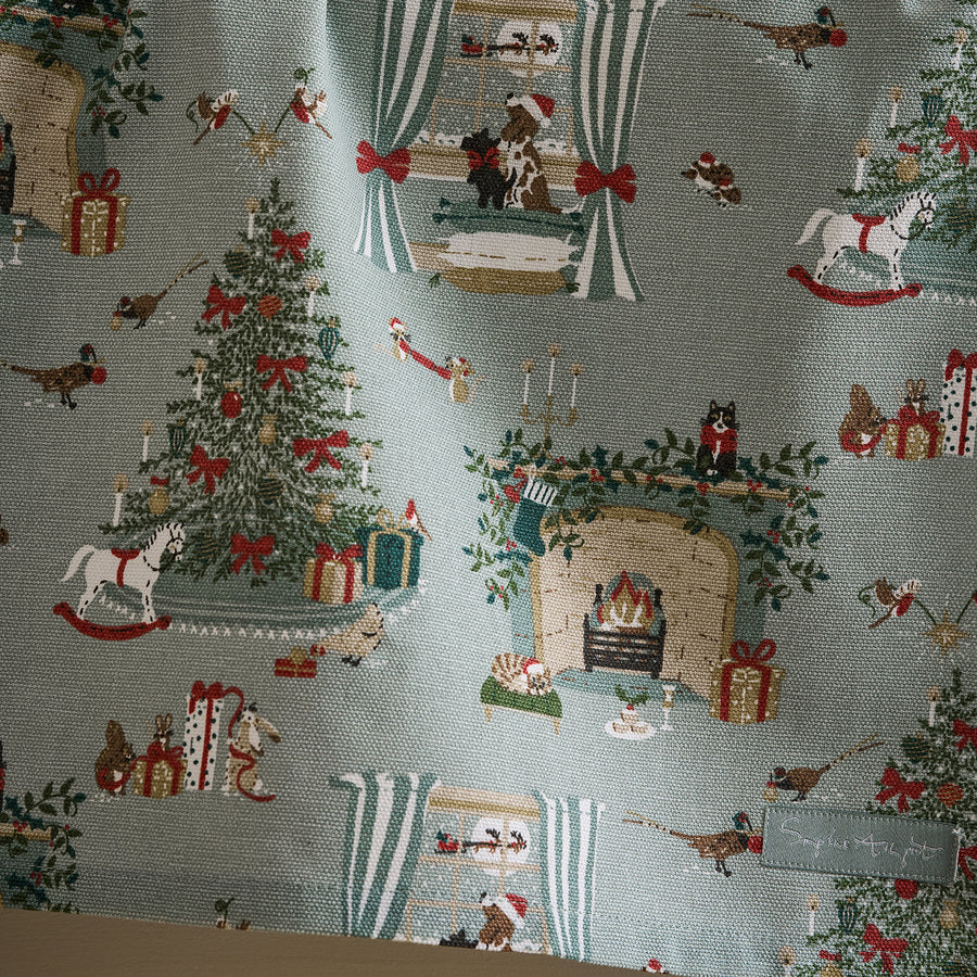 Christmas-themed fabric with trees, presents, and animals on a gray background