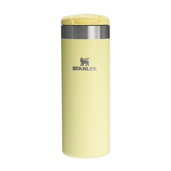 Yellow Stanley tumbler on a white background