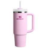 A light pink Stanley tumbler with a matching pink handle, a white lid, and a white straw, shown on a plain white background.