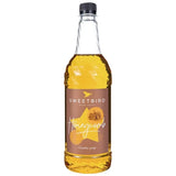 Bottle of Sweetbird honeycomb syrup on a white background