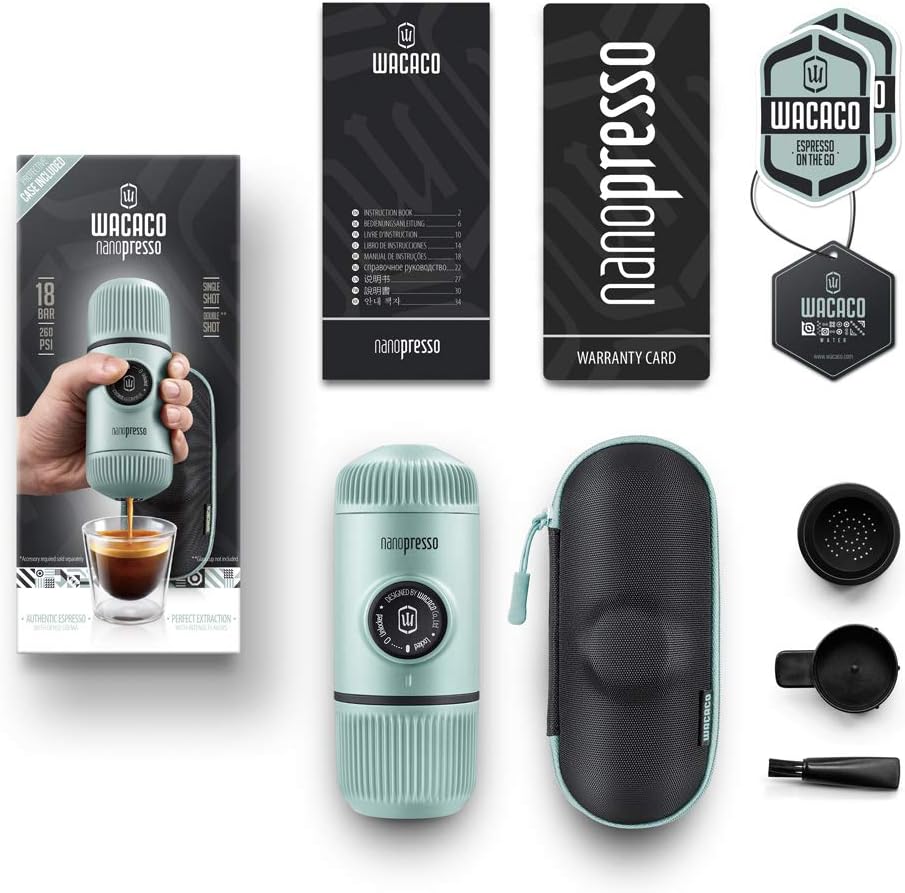Wacaco Nanopresso portable espresso maker with packaging, warranty card, and accessories on a white background.