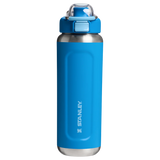Blue water bottle with silver base and Stanley logo on a white background