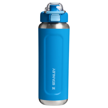 Blue water bottle with silver base and Stanley logo on a white background