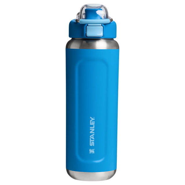 Blue water bottle with silver base and Stanley logo on a white background