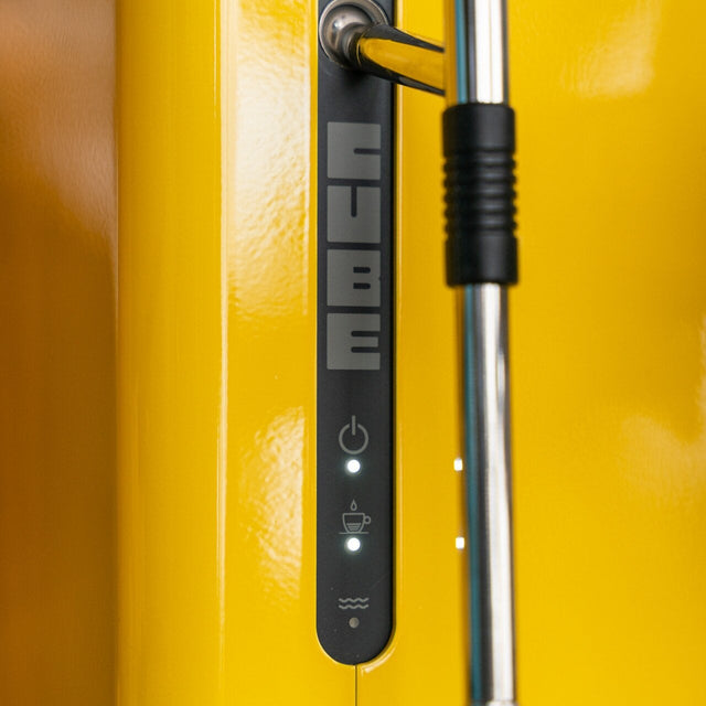 Close-up of a yellow espresso machine