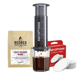 The image shows an AeroPress XL Coffee Maker with a bundle of 250g free coffee and filters. The coffee maker is black, with a clear carafe and a pack of beans labeled 'Caffè Italiano Blend' beside it.