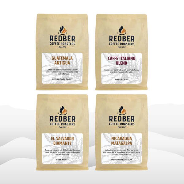 Four packages of Redber Coffee Roasters coffee on a white background