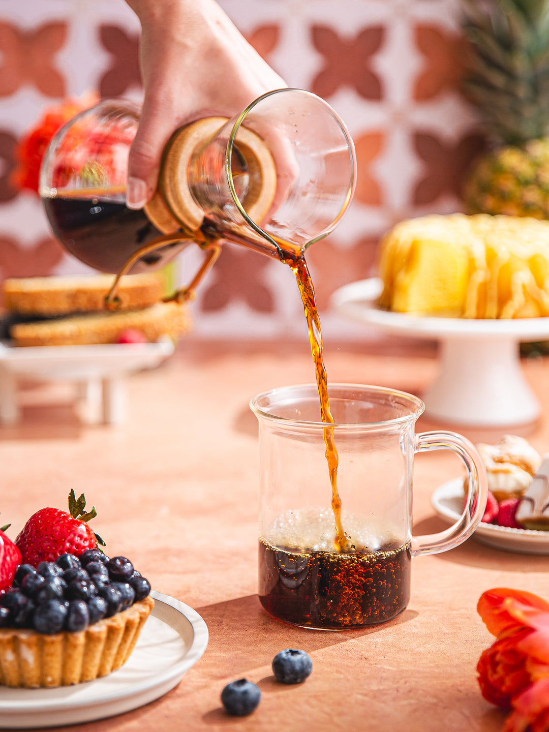 Chemex 3 Cup Classic coffee maker pouring coffee at a table
