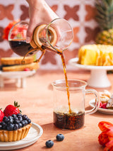 Chemex 3 Cup Classic coffee maker pouring coffee at a table