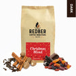 Redber Coffee Roasters Christmas Blend coffee bag with spices and dried fruits on a white background