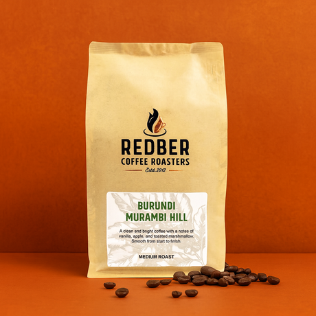 Coffee bag from Redber Coffee Roasters with Burundi Murambi Hill coffee on an orange background