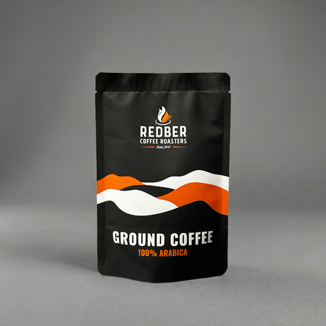 Black coffee packaging with Redber Coffee Roasters branding on a gray background