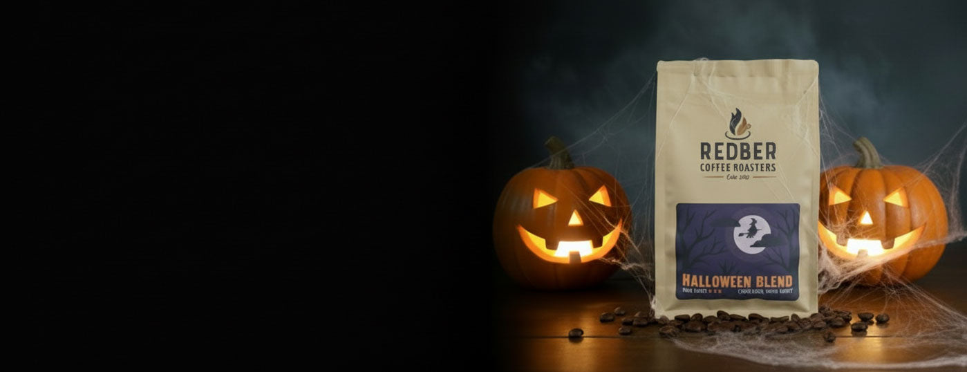 Redber Coffee Roasters Halloween Blend coffee bag with pumpkins on a dark background