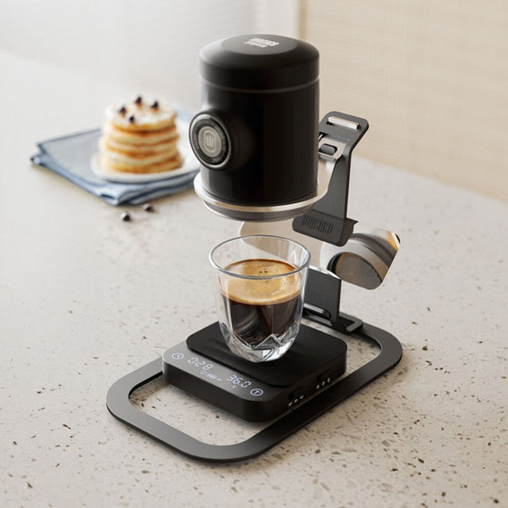 Wacaco Exagram Pro scales beneath a Picopresso stand on a kitchen worktop
