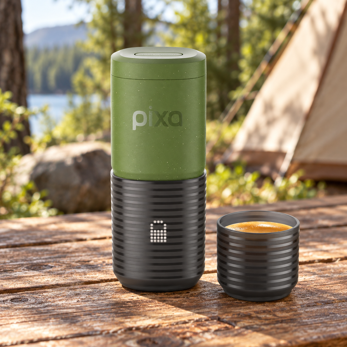 Wacaco Pixapresso Electric Portable Espresso Maker in Olive Green on a wooden table at a woodland campsite