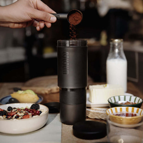 Coal Black Wacaco Prestina coffee press on a breakfast table
