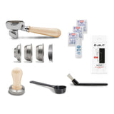 Collection of coffee-making tools including a tamper, scoop, and packaging on a white background