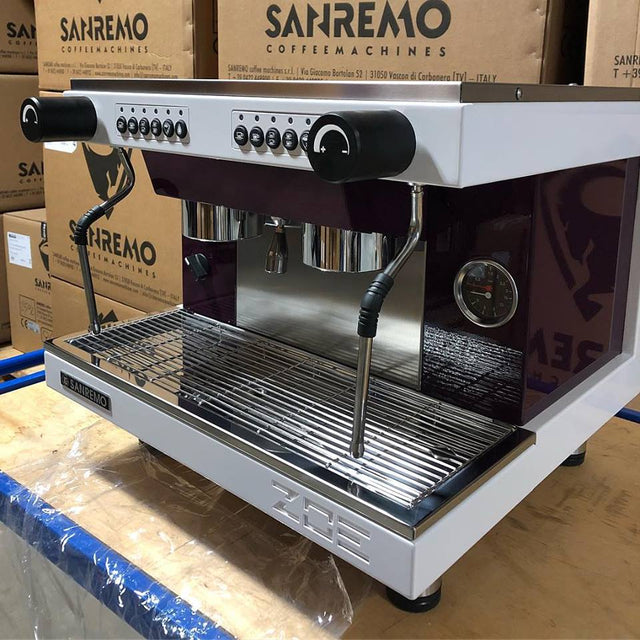Sanremo coffee machine on a wooden floor with boxes in the background